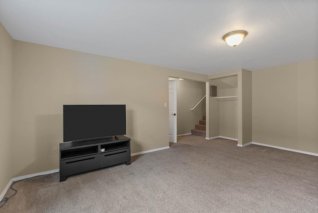 7007 N Tucannon Ct, Spokane, WA 99208 - unfurnished living room featuring carpet and stairs