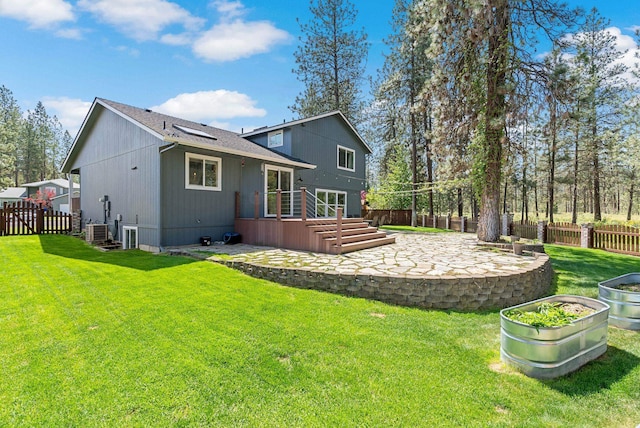 7007 N Tucannon Ct, Spokane, WA 99208 - rear view of property featuring a patio area, a fenced backyard, and a shingled roof