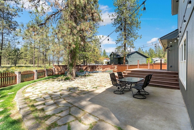 7007 N Tucannon Ct, Spokane, WA 99208 - fenced backyard featuring a patio area and outdoor dining area