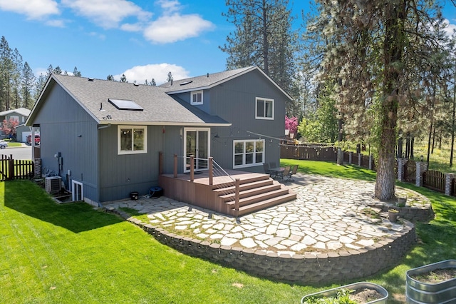 7007 N Tucannon Ct, Spokane, WA 99208 - rear view of property featuring a patio, a fenced backyard, a shingled roof, and a wooden deck