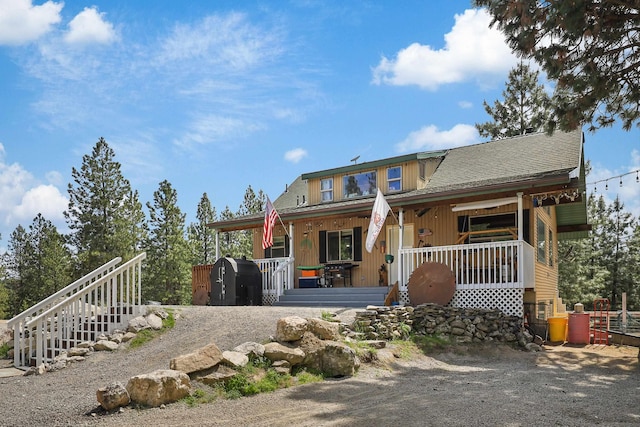 15205 N Scribner Branch Rd, Spokane, WA 99217 - rear view of property featuring a porch, driveway, and roof with shingles
