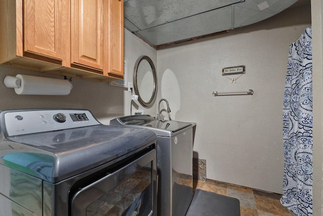 15205 N Scribner Branch Rd, Spokane, WA 99217 - clothes washing area with independent washer and dryer, cabinet space, and stone finish floors