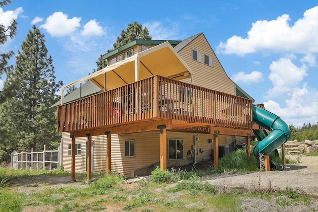 15205 N Scribner Branch Rd, Spokane, WA 99217 - back of property with a wooden deck and central AC