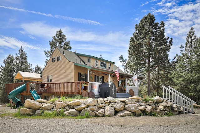 15205 N Scribner Branch Rd, Spokane, WA 99217 - back of house with a playground and a porch