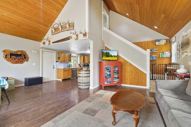 15205 N Scribner Branch Rd, Spokane, WA 99217 - living area with high vaulted ceiling, wooden ceiling, dark wood-style floors, wood walls, and baseboards