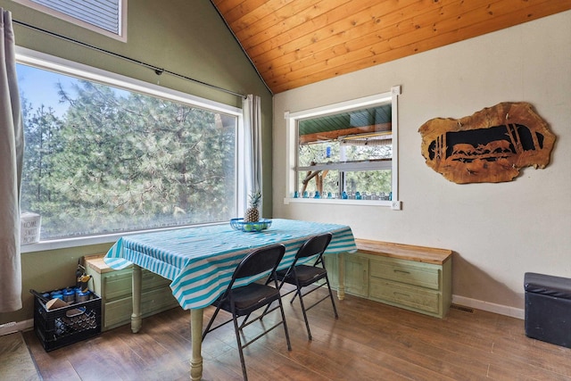 15205 N Scribner Branch Rd, Spokane, WA 99217 - dining area featuring lofted ceiling, wood finished floors, and baseboards