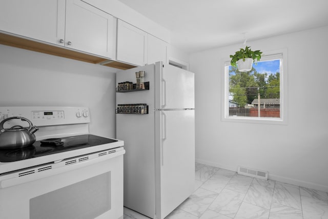 kitchen featuring white appliances, light marble finish flooring, baseboards, white cabinets, and light countertops