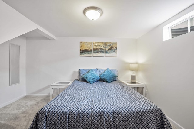 carpeted bedroom featuring baseboards