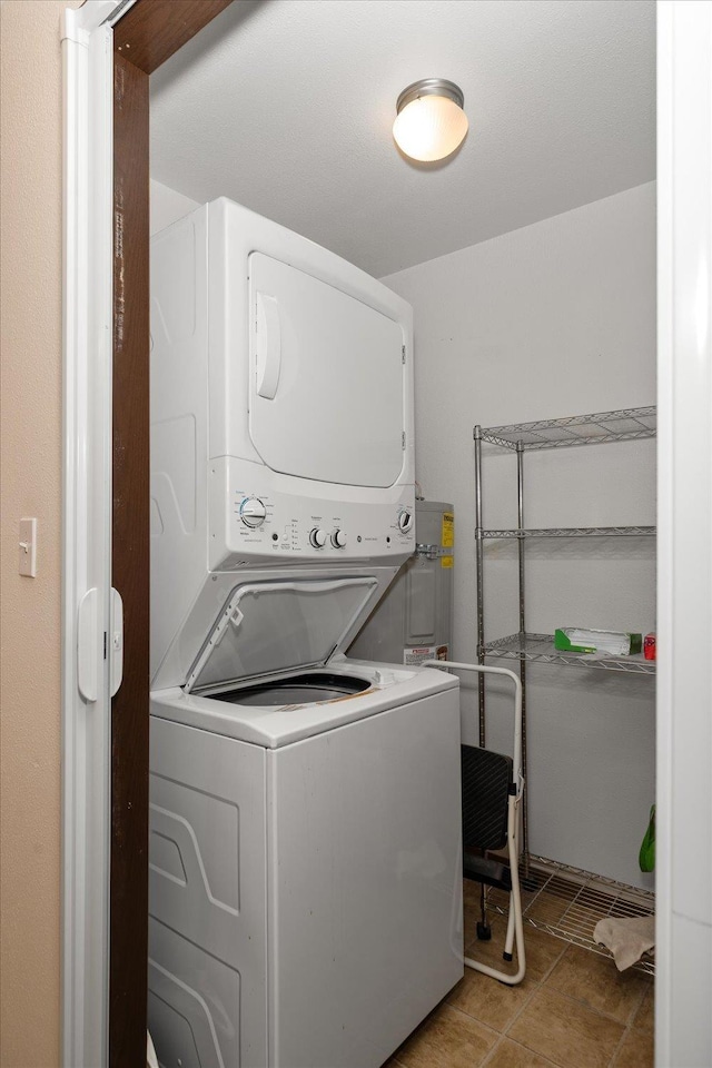 6019 E 6th Ave Unit L-201, Spokane, WA 99212 - laundry room featuring stacked washer and clothes dryer and light tile patterned floors