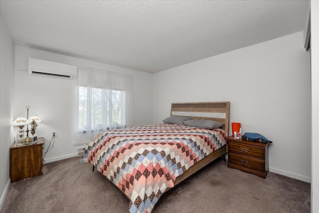 6019 E 6th Ave Unit L-201, Spokane, WA 99212 - carpeted bedroom with an AC wall unit, baseboards, and a textured ceiling