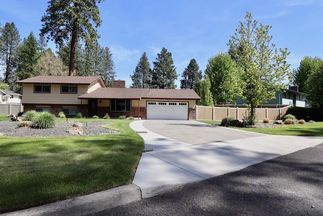 13703 E 31st Ave, Spokane Valley, WA 99216 - split level home featuring a garage, brick siding, driveway, and a chimney