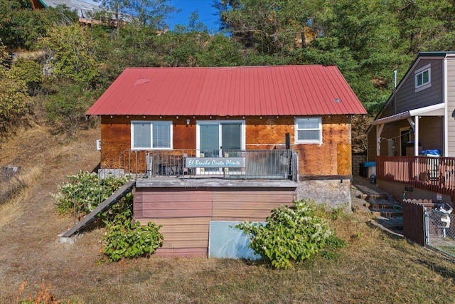 23605 E Beach Ln, Newman Lake, WA 99025 - rear view of property with stairway, metal roof, brick siding, and a deck