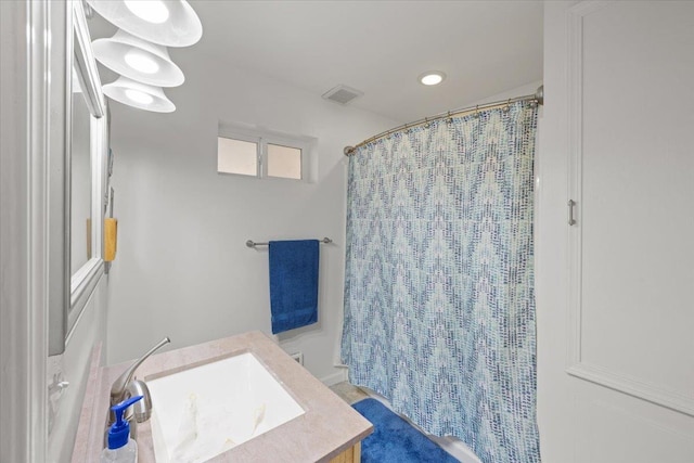 23605 E Beach Ln, Newman Lake, WA 99025 - bathroom featuring a shower with curtain, recessed lighting, and vanity