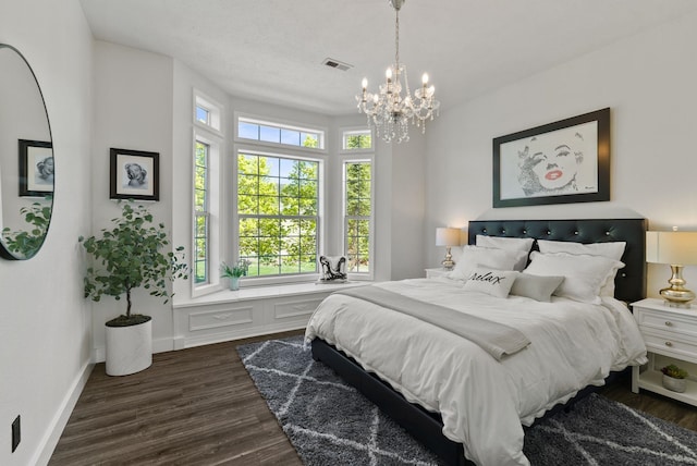 7406 S Deerview Ln, Spokane, WA 99223 - bedroom featuring a chandelier, dark wood-type flooring, and baseboards