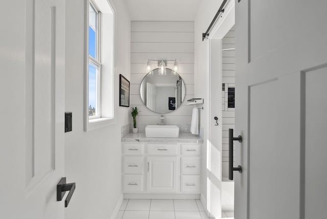 7406 S Deerview Ln, Spokane, WA 99223 - bathroom with tile patterned floors, vanity, and baseboards
