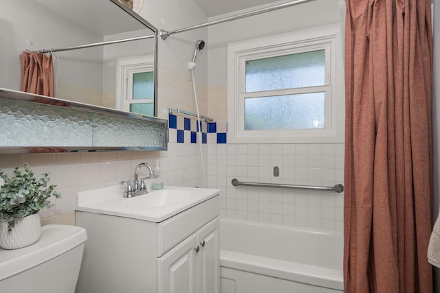 bathroom with tasteful backsplash, vanity, toilet, and shower / bathtub combination with curtain