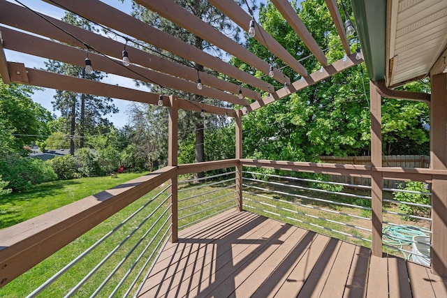 deck with a pergola, a yard, and view of wooded area