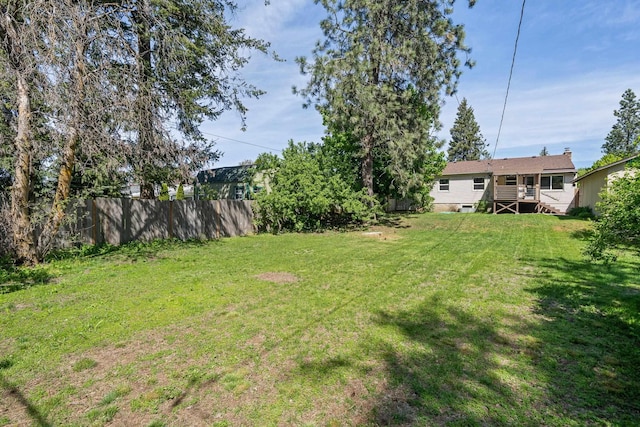 view of yard with stairs and a deck