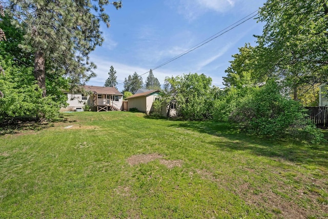 view of yard featuring a wooden deck