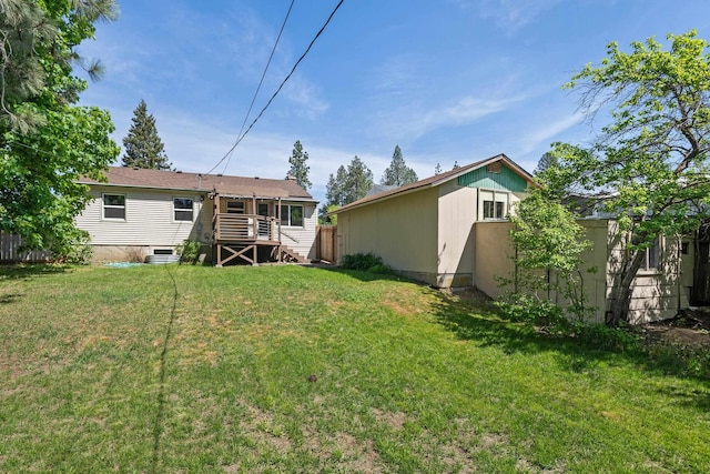 back of property featuring stairway and a deck