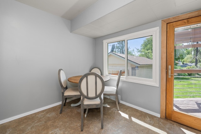 dining space featuring baseboards