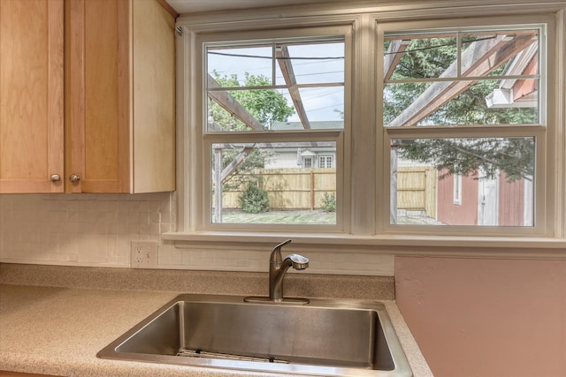 2410 W Upton Ave, Spokane, WA 99205 - kitchen featuring a sink, backsplash, and healthy amount of natural light