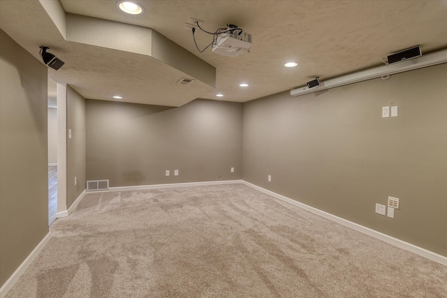 2410 W Upton Ave, Spokane, WA 99205 - finished below grade area featuring carpet, recessed lighting, baseboards, and a textured ceiling