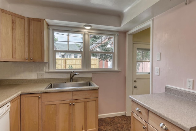 2410 W Upton Ave, Spokane, WA 99205 - kitchen with a sink, white dishwasher, baseboards, decorative backsplash, and light countertops