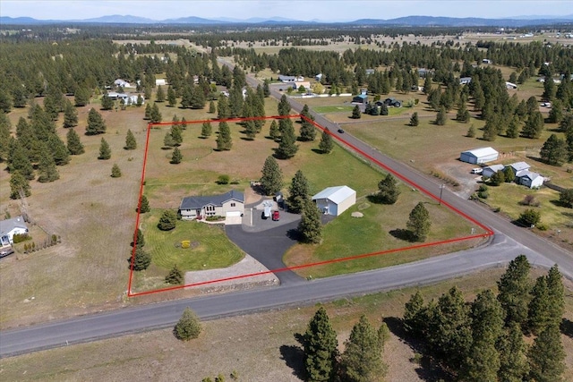 17206 W Buckboard Ave, Medical Lake, WA 99022 - aerial view of property's location with property boundaries highlighted and a mountain backdrop