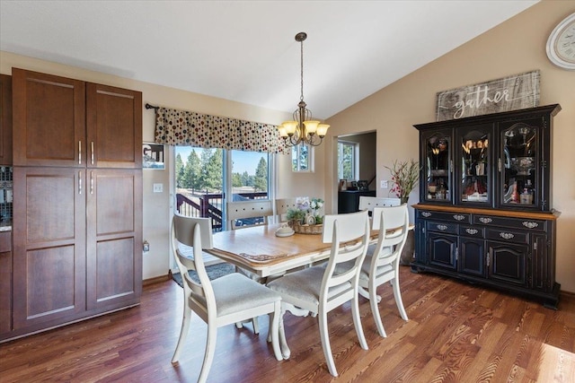 17206 W Buckboard Ave, Medical Lake, WA 99022 - dining area with a chandelier, vaulted ceiling, and dark wood-style floors