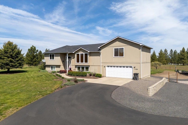 17206 W Buckboard Ave, Medical Lake, WA 99022 - split foyer home featuring an attached garage, driveway, and a front lawn
