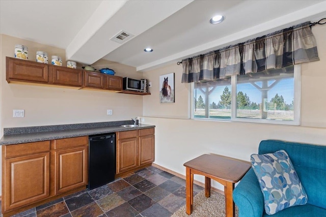 17206 W Buckboard Ave, Medical Lake, WA 99022 - kitchen with dishwasher, a sink, dark countertops, brown cabinets, and recessed lighting