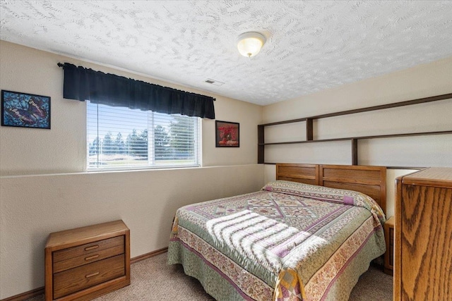 17206 W Buckboard Ave, Medical Lake, WA 99022 - bedroom featuring a textured ceiling, carpet flooring, and baseboards