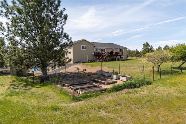17206 W Buckboard Ave, Medical Lake, WA 99022 - view of yard featuring a vegetable garden, a wooden deck, and stairs
