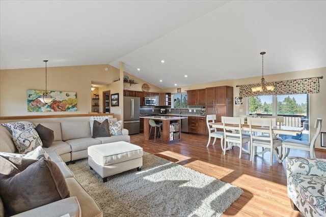 17206 W Buckboard Ave, Medical Lake, WA 99022 - living area featuring a chandelier, wood finished floors, high vaulted ceiling, and recessed lighting