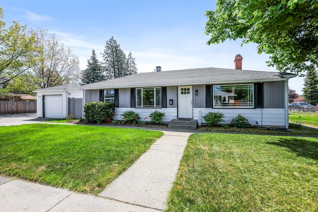 4117 W Wellesley Ave, Spokane, WA 99205 - ranch-style house featuring a chimney, concrete driveway, entry steps, and roof with shingles
