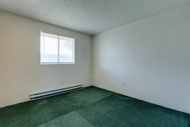 1514 3rd St, Cheney, WA 99004 - spare room featuring a baseboard heating unit, dark colored carpet, and a textured ceiling