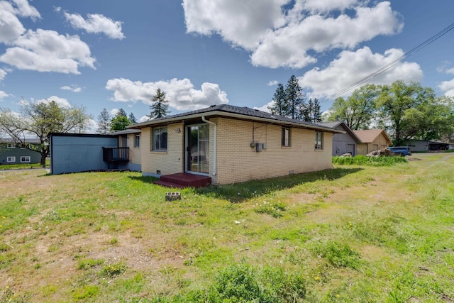 1514 3rd St, Cheney, WA 99004 - rear view of house featuring brick siding and a yard