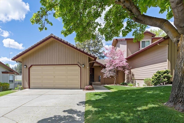 3716 S Alder Cir, Spokane, WA 99223 - view of front of property featuring an attached garage, a tiled roof, a front yard, and concrete driveway
