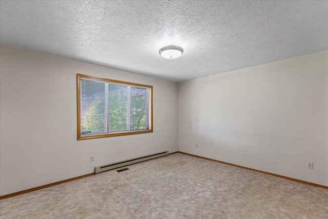 3716 S Alder Cir, Spokane, WA 99223 - empty room featuring a baseboard heating unit, carpet flooring, baseboards, and a textured ceiling