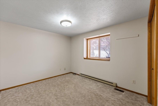3716 S Alder Cir, Spokane, WA 99223 - carpeted empty room featuring baseboard heating, baseboards, and a textured ceiling