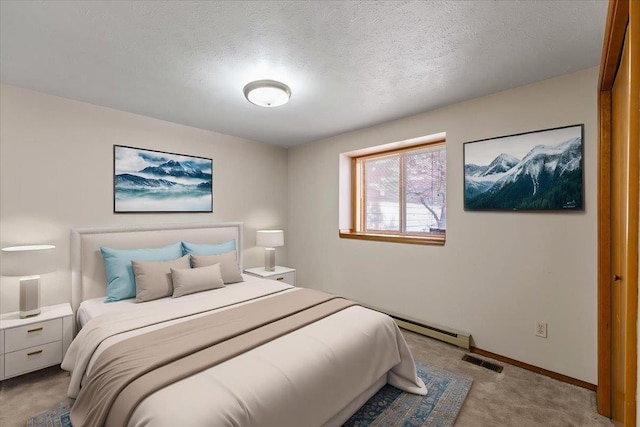 3716 S Alder Cir, Spokane, WA 99223 - bedroom with carpet flooring, baseboards, a baseboard heating unit, and a textured ceiling