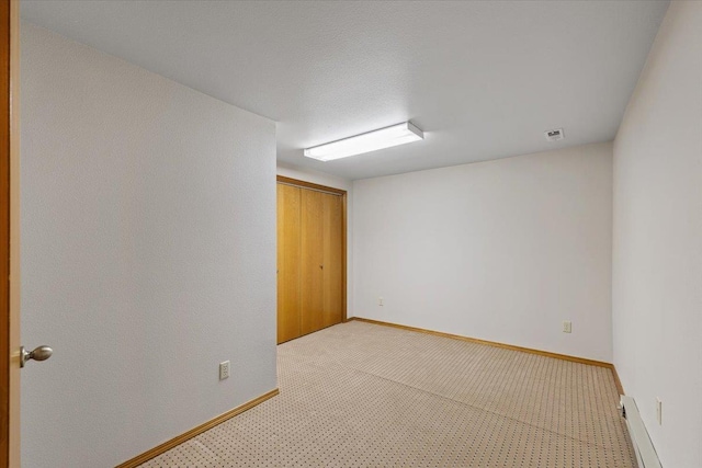3716 S Alder Cir, Spokane, WA 99223 - empty room featuring baseboard heating, light carpet, and baseboards