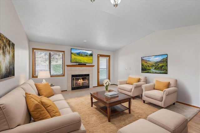 3716 S Alder Cir, Spokane, WA 99223 - living area with vaulted ceiling, plenty of natural light, a tile fireplace, and baseboards