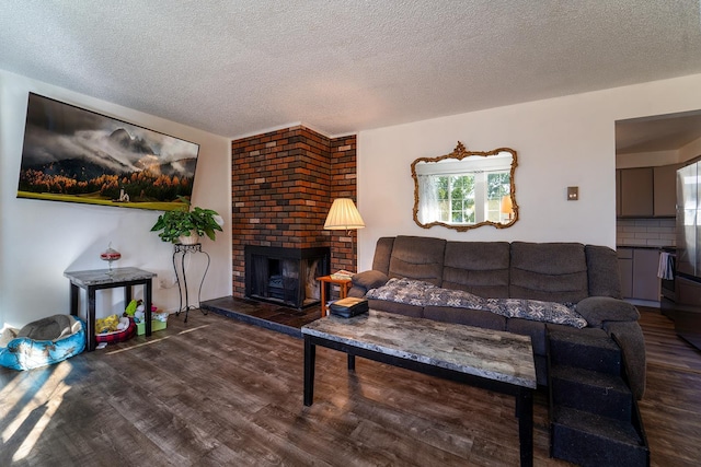 3817 E Frederick Ave, Spokane, WA 99217 - living area with wood finished floors, a textured ceiling, and a brick fireplace