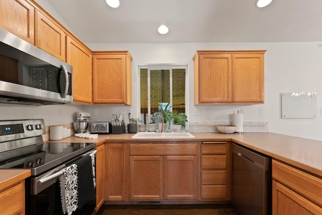 3022 E Pineglen Ave, Mead, WA 99021 - kitchen with appliances with stainless steel finishes, a sink, light countertops, and recessed lighting