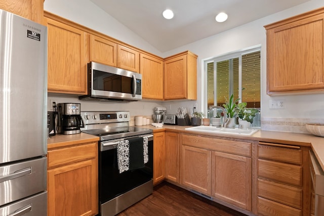 3022 E Pineglen Ave, Mead, WA 99021 - kitchen with appliances with stainless steel finishes, light countertops, a sink, lofted ceiling, and recessed lighting