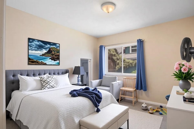 bedroom featuring carpet floors and baseboards
