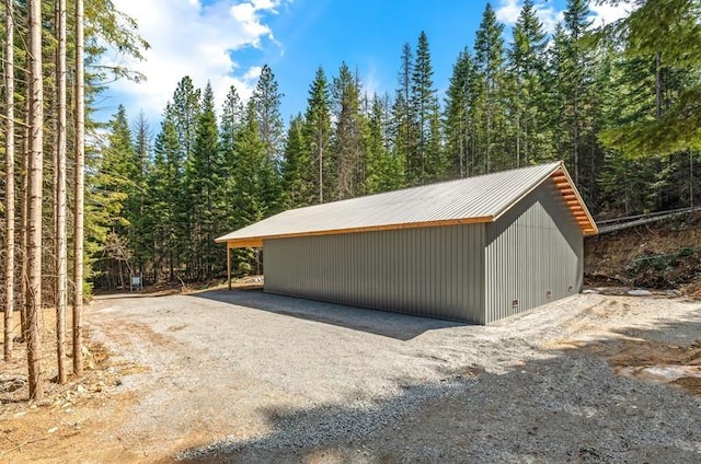 4821 Coyote Trl, Newport, WA 99156 - view of outdoor structure featuring a wooded view and an outbuilding