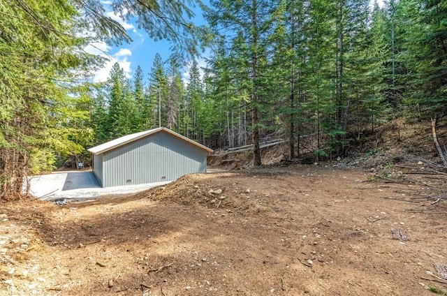 4821 Coyote Trl, Newport, WA 99156 - view of outbuilding featuring a forest view and an outdoor structure